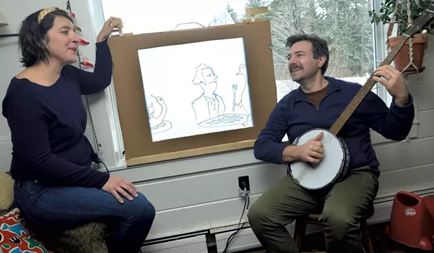 Lander plays the banjo while Friedman turns the crank of a handmade paper "movie." - STEFAN HARD