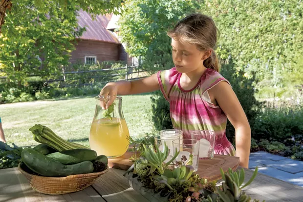 Mavis adds mint sprigs to lemonade - JAMES BUCK
