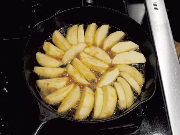 Apples arranged on top of a layer of caramel - ANDY BRUMBAUGH