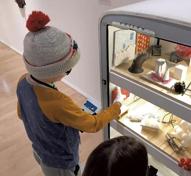 Henry checks out Matt Neckers' open refrigerator - HEATHER POLIFKA-RIVAS