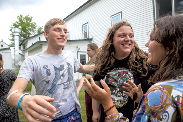 ReTribers Peter Orzech, Riley Craig and Maddie Parker (left to right) embrace on the final day of Inner Journeys - JAMES BUCK