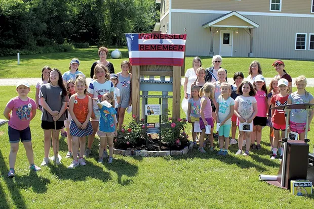 Girls at Camp Farnsworth flank the new Rosie the Riveter garden - COURTESY OF GIRL SCOUTS OF THE GREEN AND WHITE MOUNTAINS