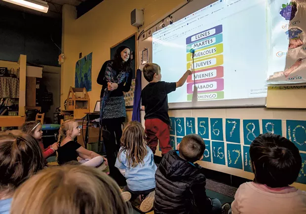 A student in Sylvan Ross' Spanish immersion kindergarten class at Jericho Elementary School reads the days of the week - GLENN RUSSELL