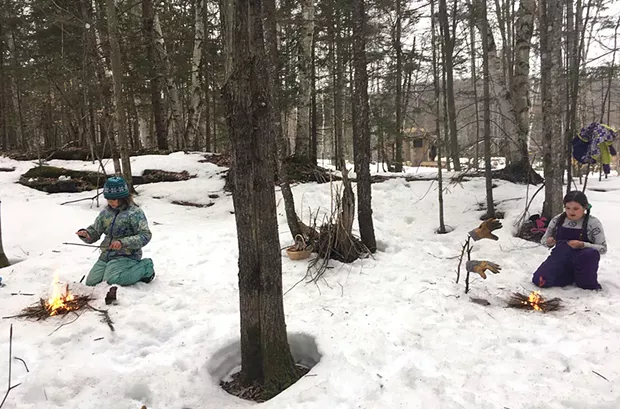 Katie Lane-Karnas' children practicing their fire-making technique - COURTESY OF KATIE LANE-KARNAS