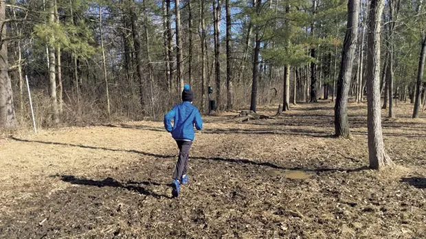 Heather's son, Jesse, explores a muddy field - COURTESY OF BEN WANG