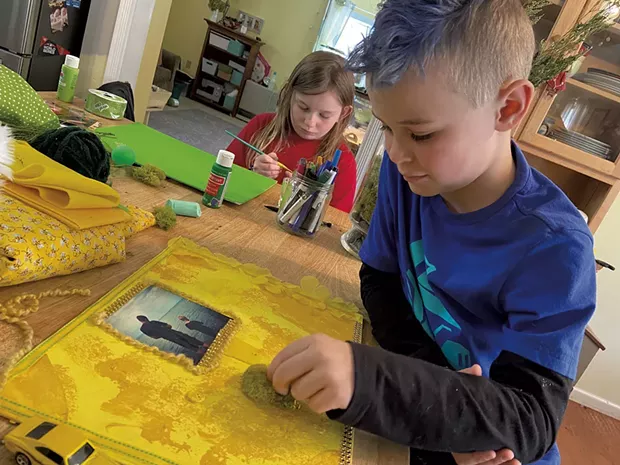 Maggie and Aidan creating collages - COURTESY OF TRISH VAN VLIET