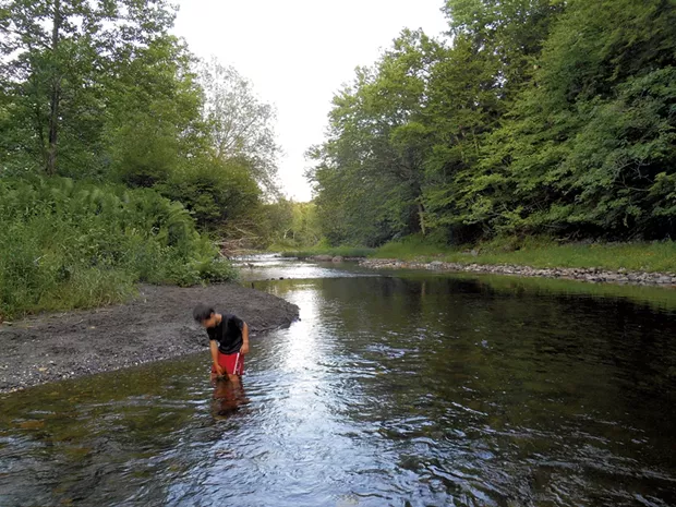 Heather's son Jesse wading in Québec's Tomifobia River in 2014 - HEATHER FITZGERALD