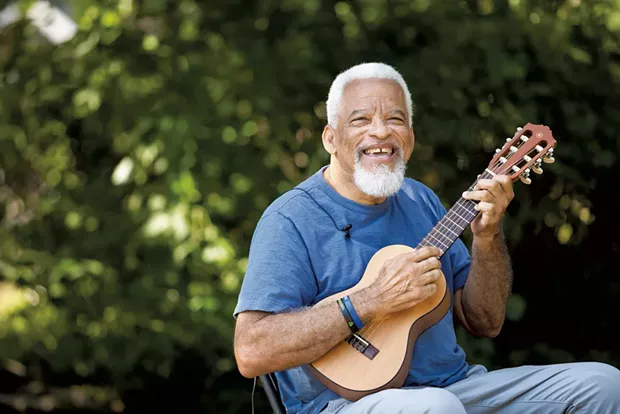 Musician Michael Dyke says he never leaves the house without an instrument in hand - CAT CUTILLO