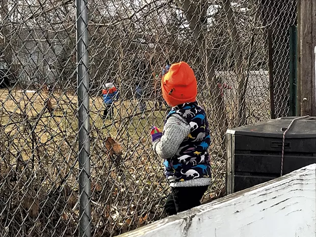 Keegan's daughter Coraline watches from afar as neighbors play - KEEGAN ALBAUGH