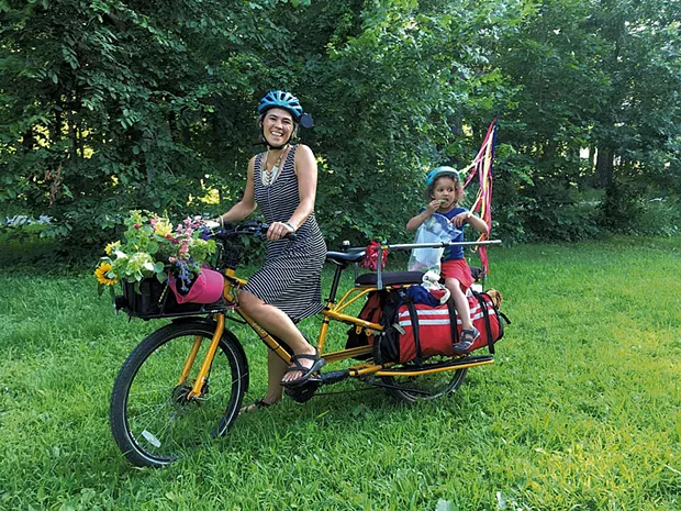 Sueno LeBlond and Autumnrose on a cargo bike - COURTESY OF CAITLIN BURLETT