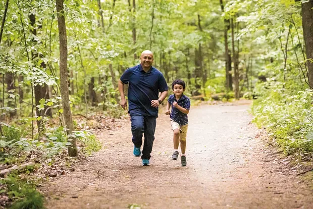 Rija Ramahatra and his son, Mathéo, at Niquette Bay State Park in Colchester - CAT CUTILLO