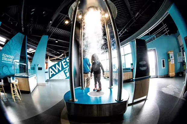 Chris and daughter Charlotte exploring ECHO'S tornado vortex, part of the "Awesome Forces" exhibit - CAT CUTILLO