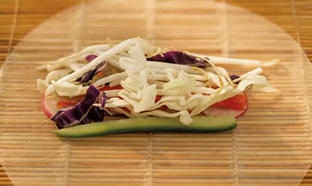 Filling the vegetable spring roll - ANDY BRUMBAUGH
