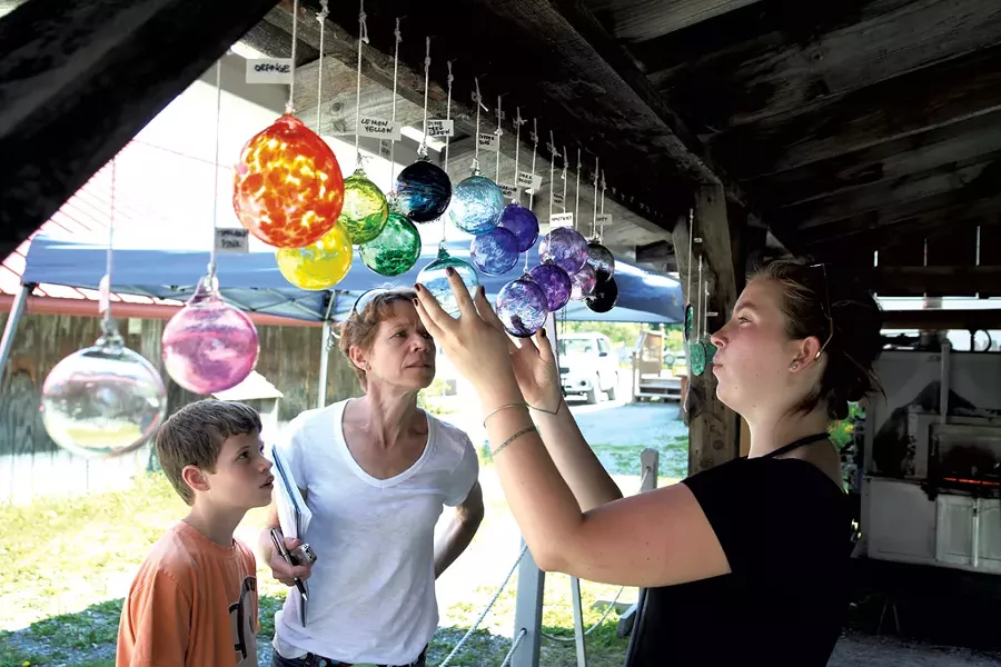 Mary Ann Lickteig and son Andrew admiring the ornaments - MATTHEW THORSON