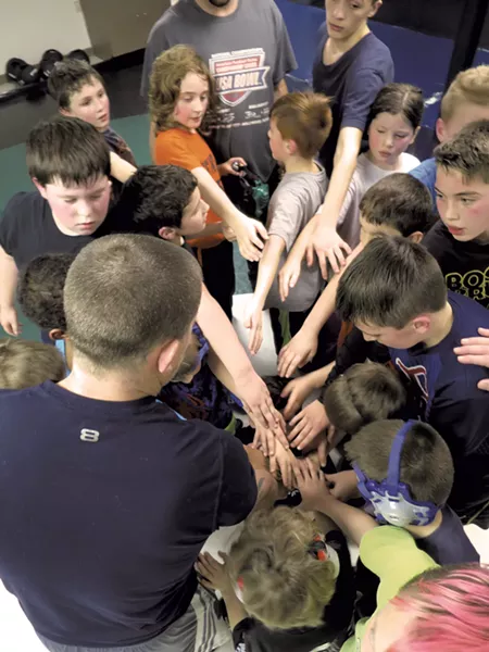 The Cobras huddle - MATTHEW THORSEN