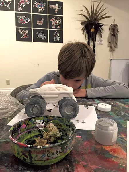 Theo paints his monster truck - ALISON NOVAK