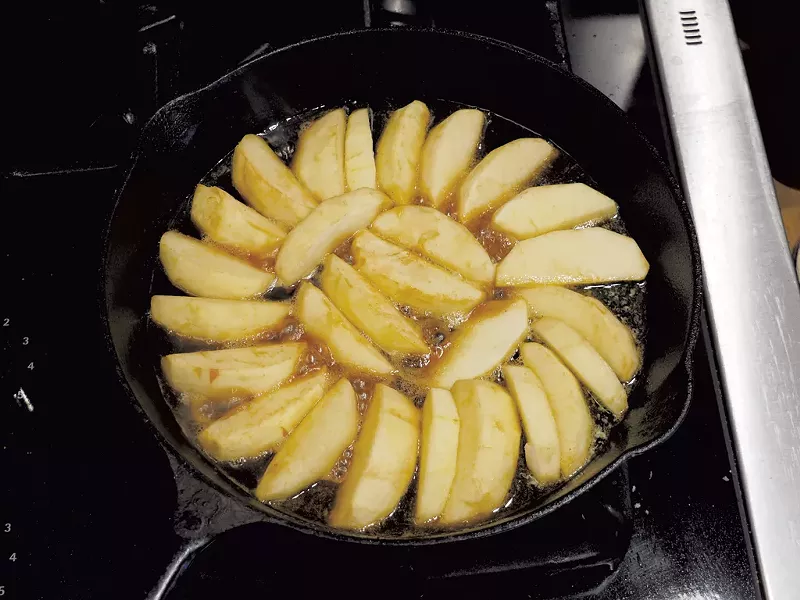 Apples arranged on top of a layer of caramel - ANDY BRUMBAUGH