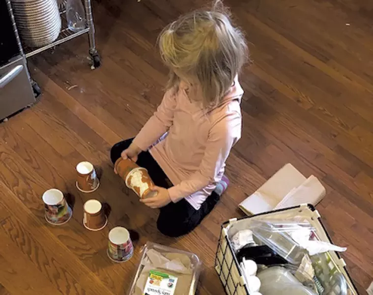 Meredith's daughter explores materials in the family's reuse zone - MEREDITH BAY-TYACK