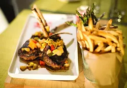 Butcher block with Colorado lamb chops from Bistro Joe’s in Birmingham. - ROBERT WIDDIS