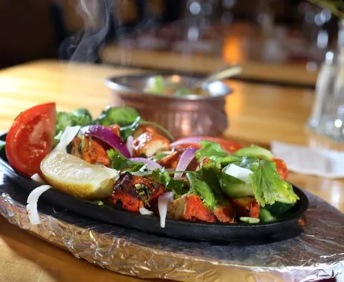 Chicken Tikka, front, and Mutter Paneer, back, from Touch of India in Birmingham. - ROBERT WIDDIS