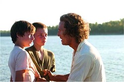 Matthew McConaughey, with Tye Sheridan and Jacob Lofland, are hiding from the law along the Mississippi River in Mud.