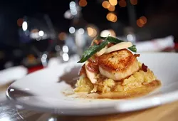 Sautéed sea scallops with spaghetti squash, smoked apples, bacon, brown butter and sage, from the Meeting House in Rochester. - ROBERT WIDDIS