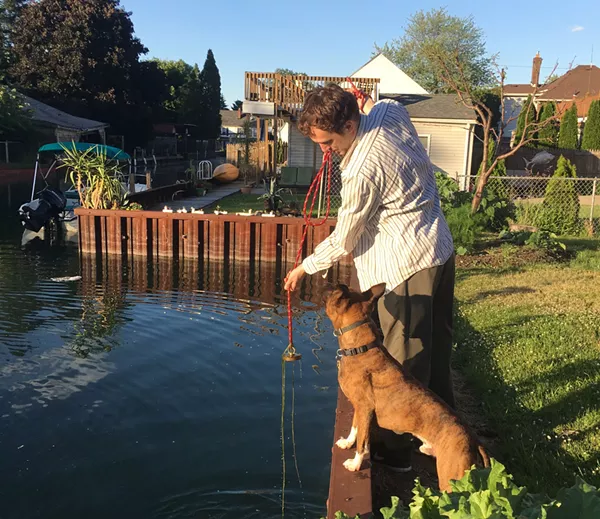 Ben Lambert comes up empty-handed while magnet fishing off Harbor Island. His mother and other neighbors have already gotten the good stuff. - VIOLET IKONOMOVA