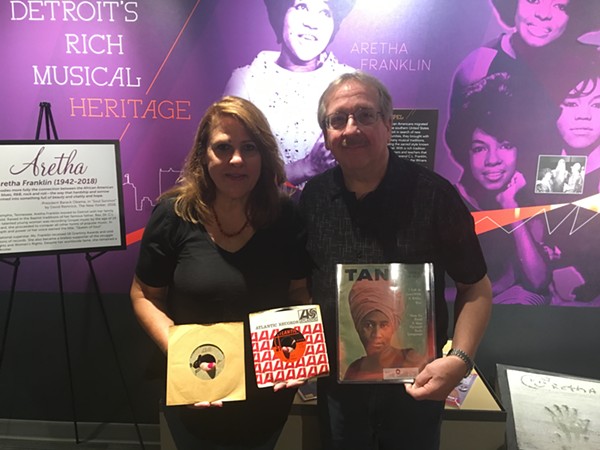 Denise and Dan Zieja have loaned boxes of Aretha Franklin memorabilia to the Detroit Historical Museum. Denise holds the "Respect" test pressing in her right hand, and the final version in her left. - LEE DEVITO