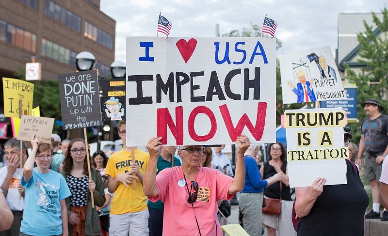 Demonstrators protested President Donald Trump in cities across the country in July following Trump's surrender to Vladimir Putin in Helsinki, Finland, including a contingent on the U-M campus in Ann Arbor. - KATIE RAYMOND