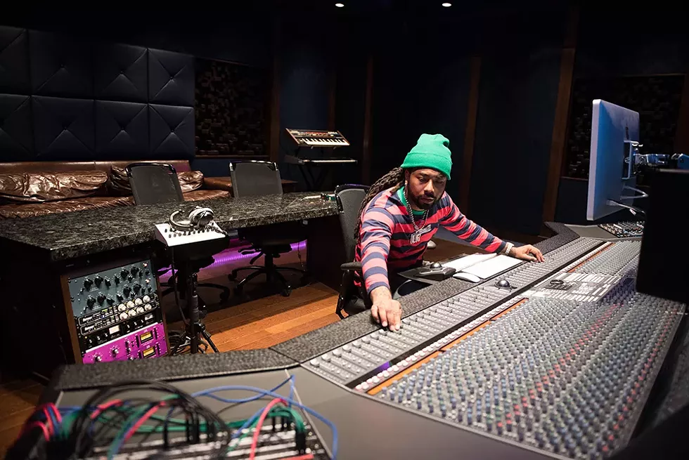 Icewear Vezzo works the 48-channel SSL console at Royal House Recording. - KAHN SANTORI DAVISON