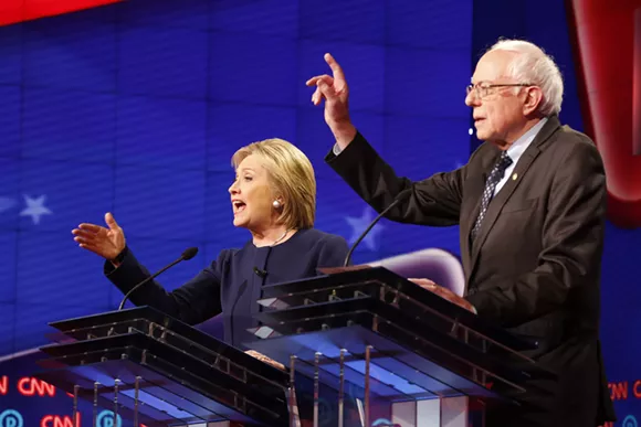 Former Secretary of State Hillary Clinton, left, and Vermont Sen. Bernie Sanders during Sunday's Democratic presidential debate at The Whiting Auditorium in Flint. - PHOTO COURTESY OF CNN