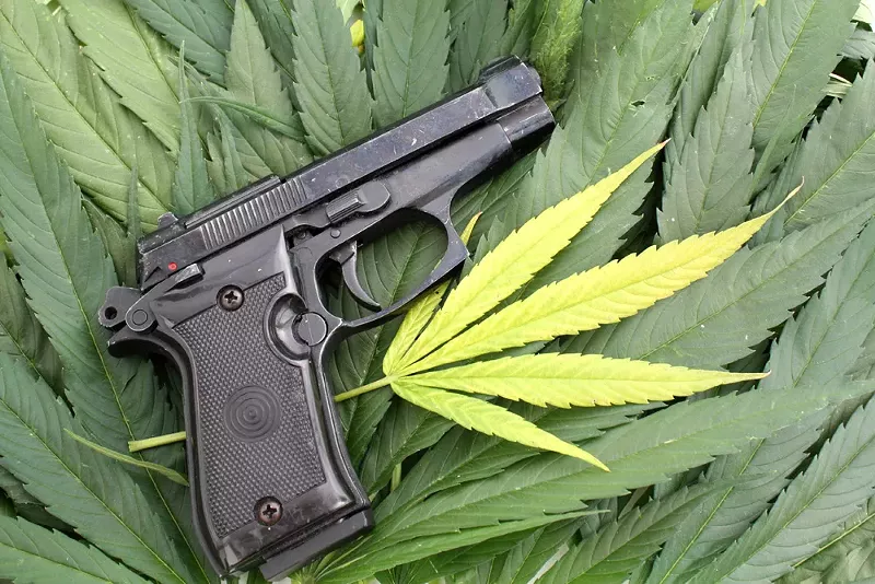 On the federal level, marijuana is still illegal, and it's a felony punishable by up to 10 years in prison to smoke pot and buy or own a gun. - SHUTTERSTOCK