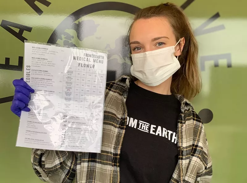 From the Earth employee holding a laminated menu. - FROM THE EARTH