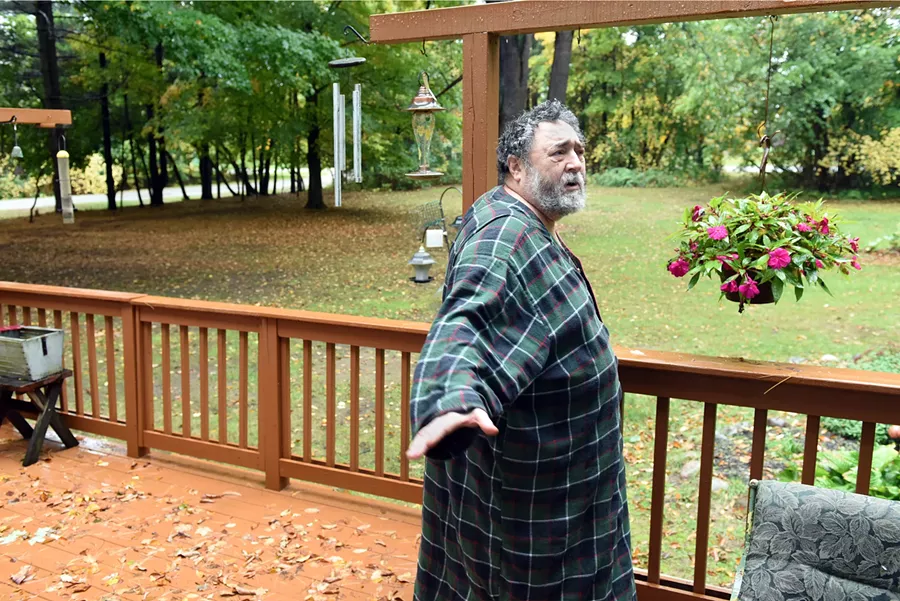 Joel Selman on the deck of his Southfield home. He was convicted in May on a delivery and manufacture of marijuana charge in a case that began in 2010. “I was in a wheelchair at sentencing,” Selman says. - PHOTO BY VAUGHN GURGANIAN