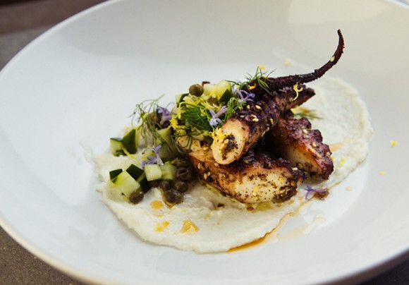 Za'atar-rubbed octopus with garlic, cucumber, and fresh herbs. - PHOTO BY JANNA COUMOUNDOUROS, LILACPOP STUDIO