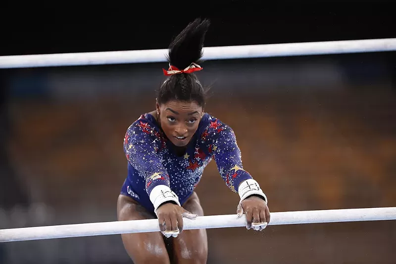 Simone Biles joins a rare list of GOATs, including Muhammad Ali, Jackie Robinson, Colin Kaepernick, and Billie Jean King, whose courage in and out of the arena taught us something more about ourselves. - A.RICARDO / SHUTTERSTOCK.COM