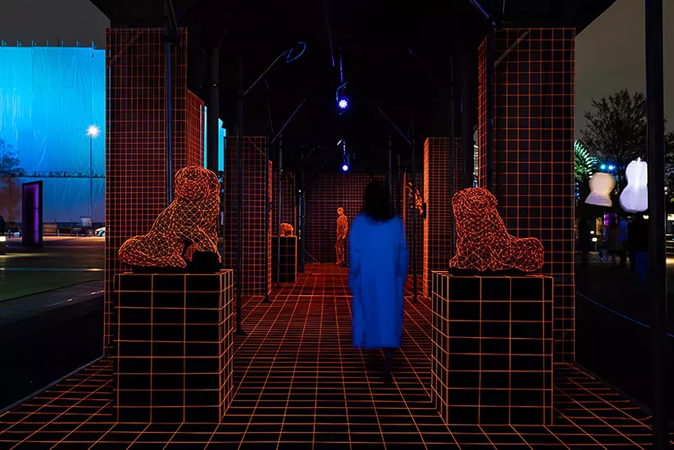 Artist Takayuki Mori covers objects in fluorescent lines, creating the illusion of a 3D virtual reality world, as part of Detroit's Dlectricity festival. - KEN KATO
