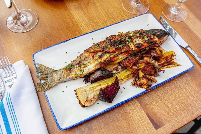 A whole, brag-worthy-size trout had a crisp skin and was served with umamiful shiitakes and roasted spring onions and beets. - LIZZ WILKINSON
