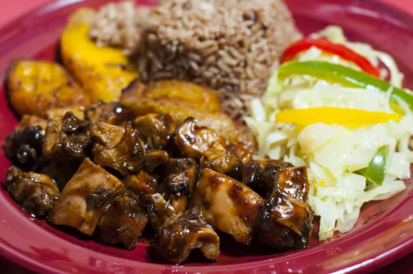 Jerk chicken at Jamaican Pot. - PHOTO BY TOM PERKINS