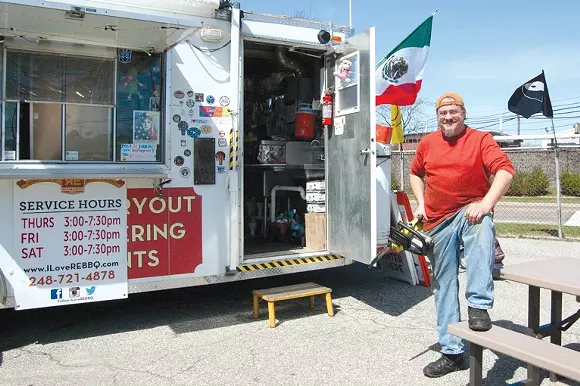 Bob Perye’s stationary food truck is Ferndale’s neighborhood barbecue joint. - LEE DEVITO