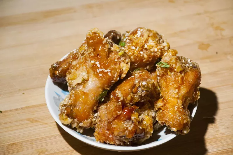 Spicy orange wings from Common Pub. - TOM PERKINS