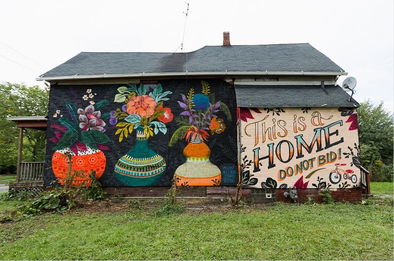 A message painted on a foreclosed Detroit home aims to make it easier for the family inside to buy it at auction. - MICHELE OBERHOLTZER