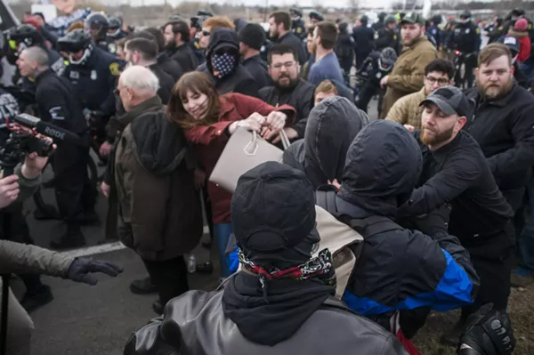 Anti-fascist demonstrators clash with white supremacists outside Richard Spencer's talk at Michigan State University. - TOM PERKINS
