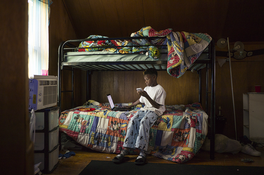 Shakiya Robertson's son Kye'Ren hangs out in his bedroom, which he shares with his older brother Ky'Shaun. - IAIN MAITLAND
