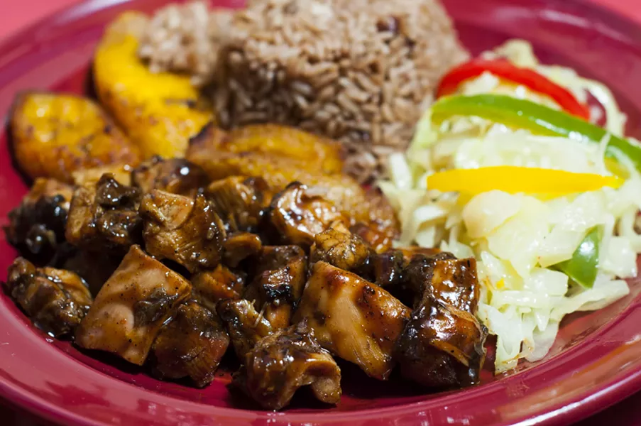 Jerk chicken at Jamaican Pot. - PHOTO BY TOM PERKINS