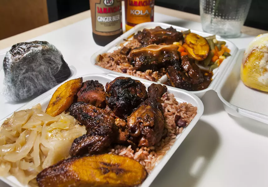 Jerk chicken and Jamaican Oxtail at Caribbean Citchen. - PHOTO BY TOM PERKINS