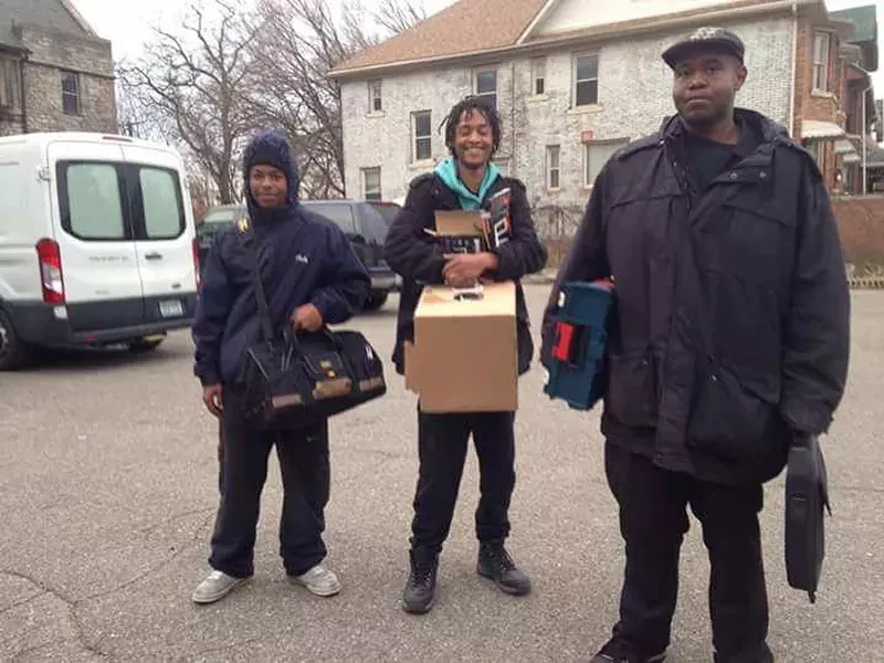The Equitable Internet Initiative, including digital steward Dwight Roston, middle, aims to install internet for 50 homes in three different Detroit neighborhoods. - COURTESY PHOTO