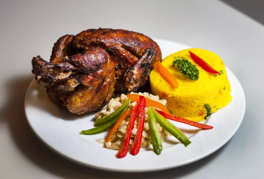 Whole chicken, couscous, and marinated onions at Maty's - TOM PERKINS