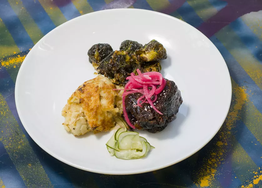 Brussel's sprouts (top) at River Bistro. - TOM PERKINS