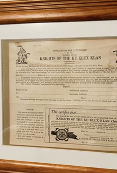 A framed Ku Klux Klan application form was left displayed in the house of a white Michigan police officer while a Black man was there with a real estate agent.